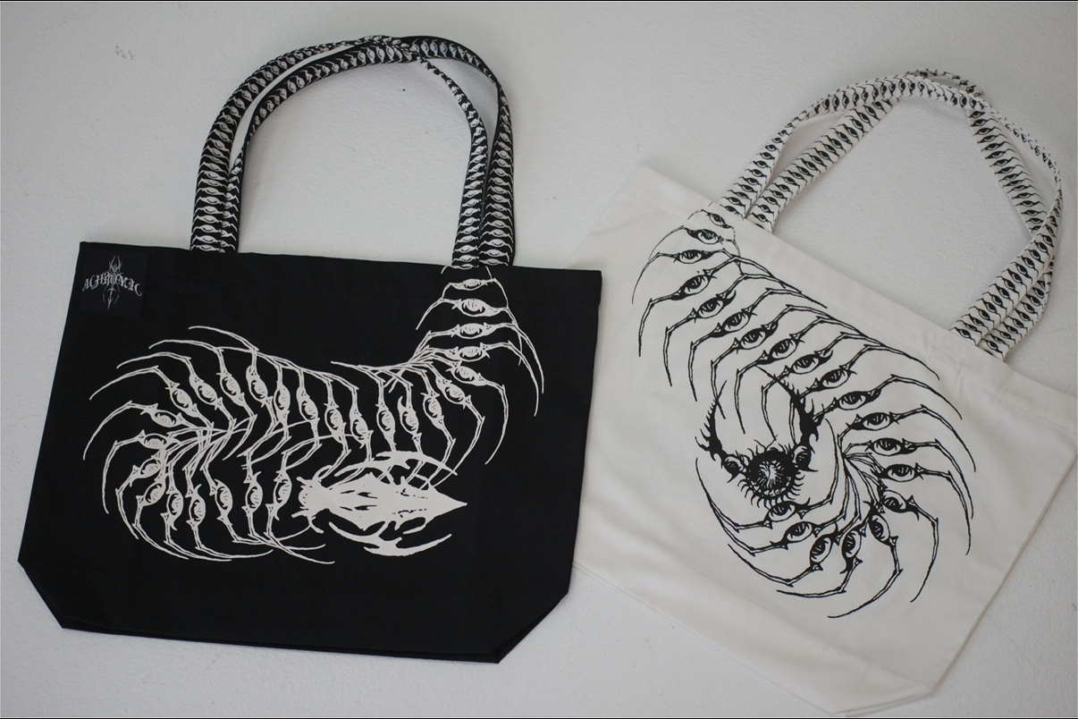 Black tote bag with white Centipede design on a white background